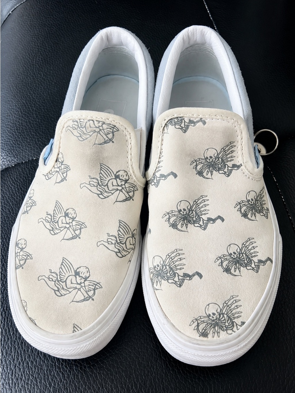 Converse Kids Slip-On Sneakers in Cream with Angel & Skeleton Print